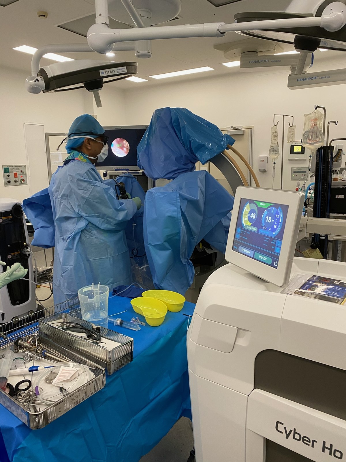 Holmium laser theatre setup with endoscopic monitor and laser platform