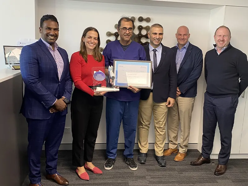 Dr Raji Kooner with the Urology NSW team and Boston Scientific representatives, holding the Rezum 200 procedure Certificate of Achievement